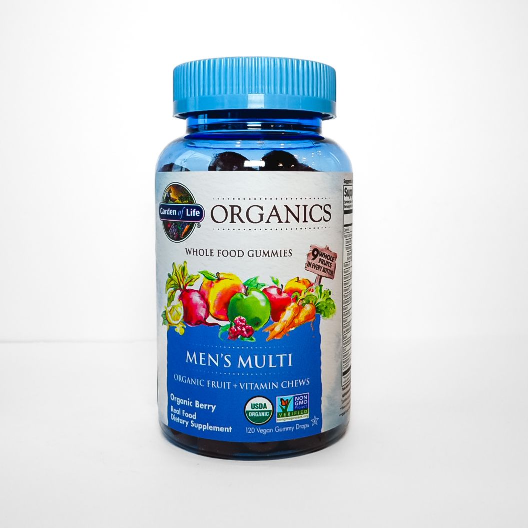 Blue bottle of Organics Men’s Multi vitamins with colorful fruit label on white background