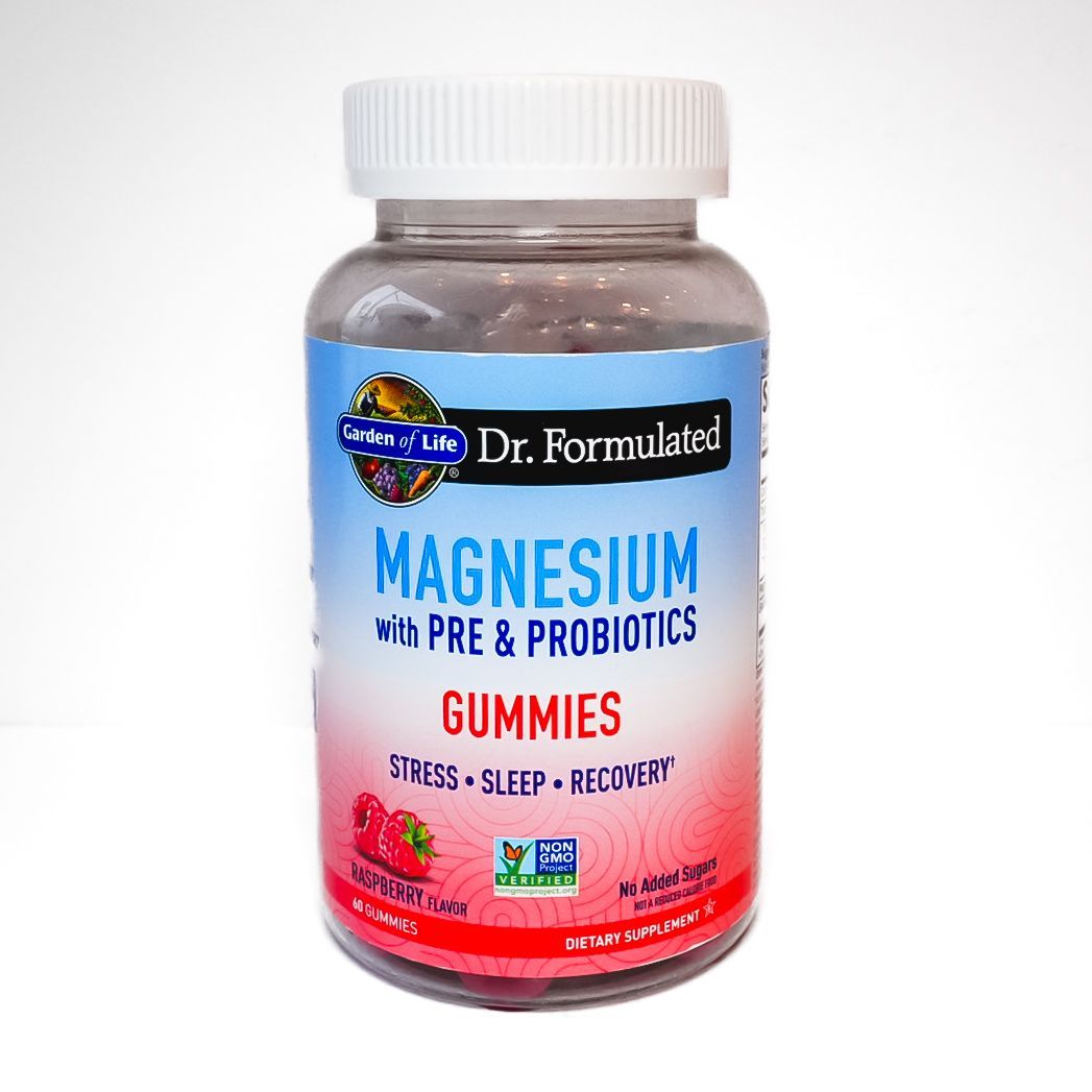 Bottle of Dr. Formulated Magnesium gummies with prebiotics, white cap and pink-blue label.