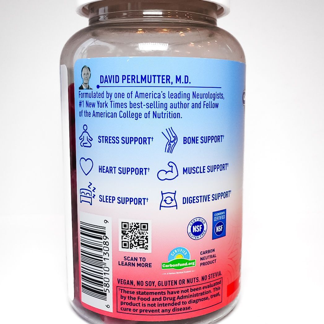 Bottle of Dr. Formulated Magnesium gummies with prebiotics, white cap and pink-blue label.