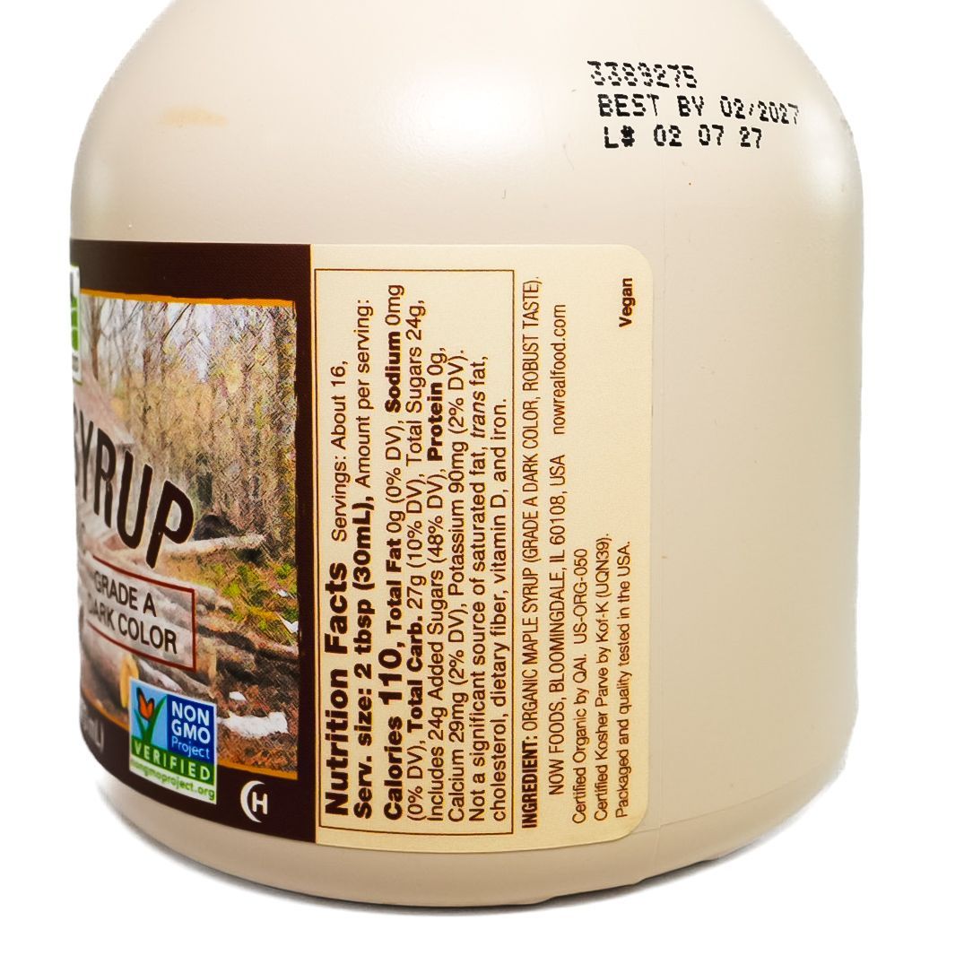 Plastic maple syrup jug with black cap and tan label on a white background