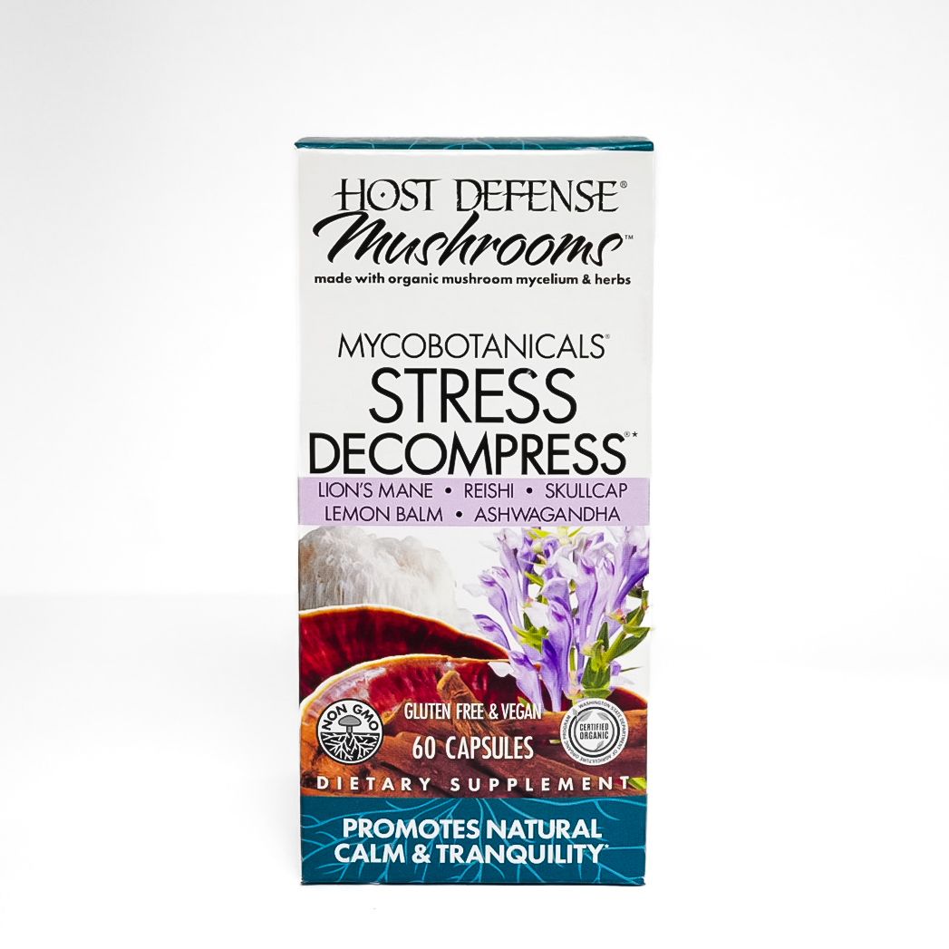 Box of Host Defense Mushrooms “Stress Decompress” supplement with purple flowers and berries on the label