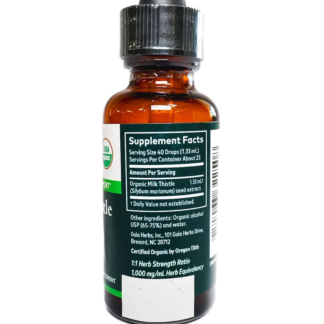 Brown glass dropper bottle labeled “Milk Thistle Seed” on a white background