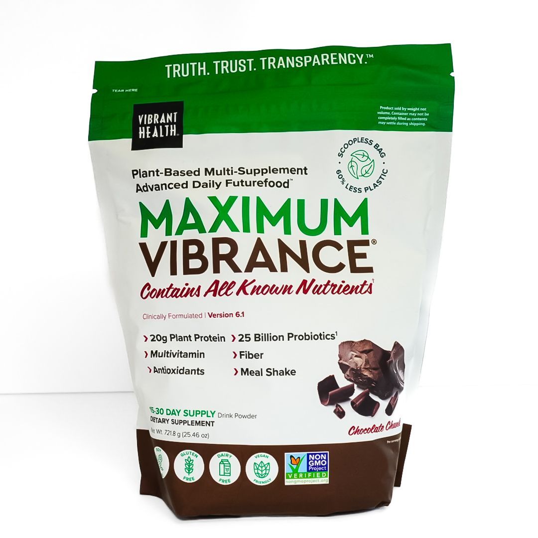 Green-and-white bag of Maximum VIBRANCE pet food with brown kibble illustration