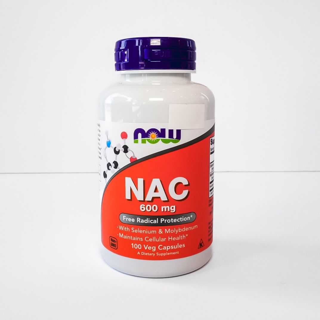 NOW NAC 600 mg supplement bottle with purple cap and red label on a white background
