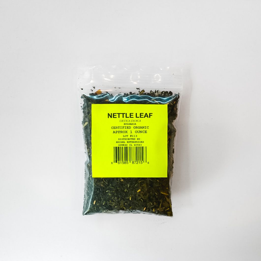Small clear bag of dried nettle leaf with bright yellow label on white background