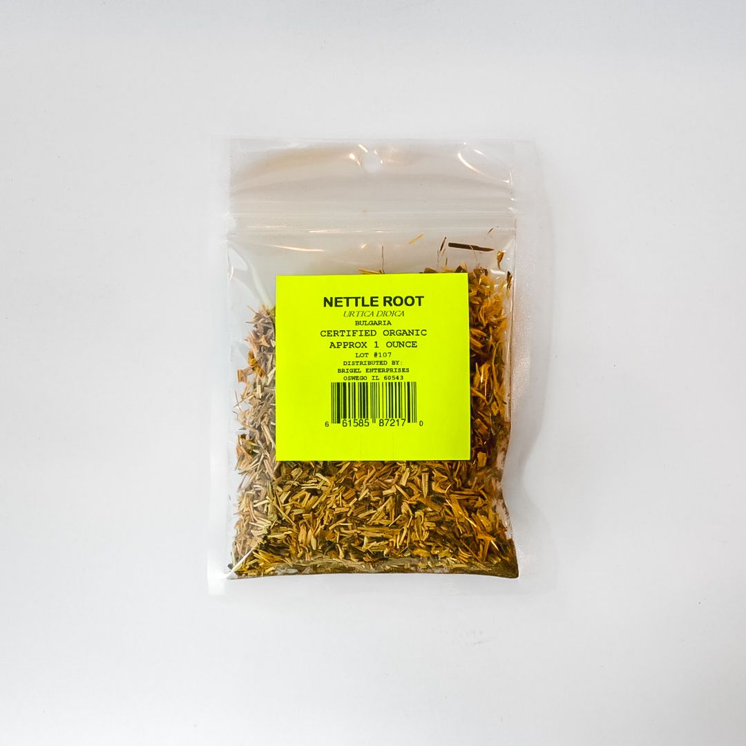 Clear plastic bag of dried nettle root with a bright yellow label on a white background