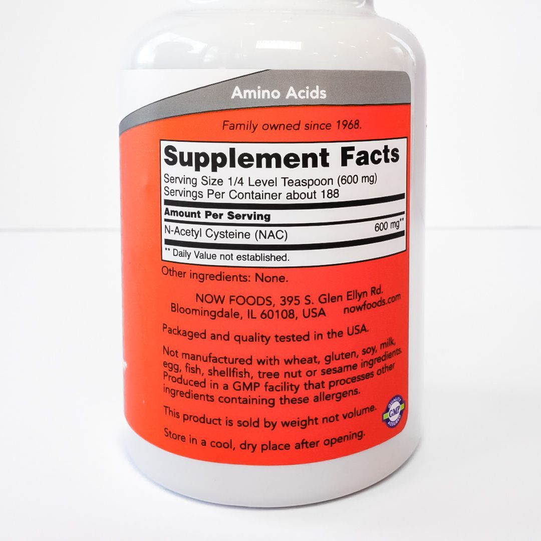 NOW NAC Pure Powder supplement bottle with purple cap and red label on a white background