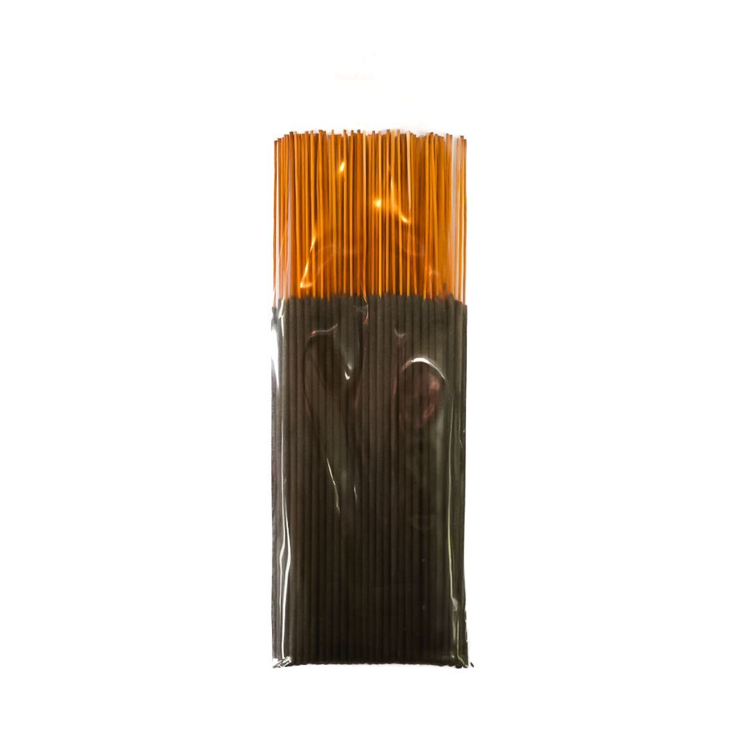 Package of black incense sticks with a yellow label on a white background