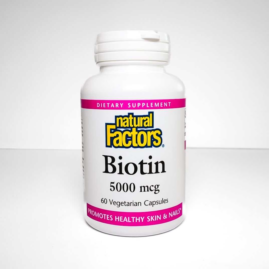 Natural Factors Biotin 5000 mcg dietary supplement bottle with pink label