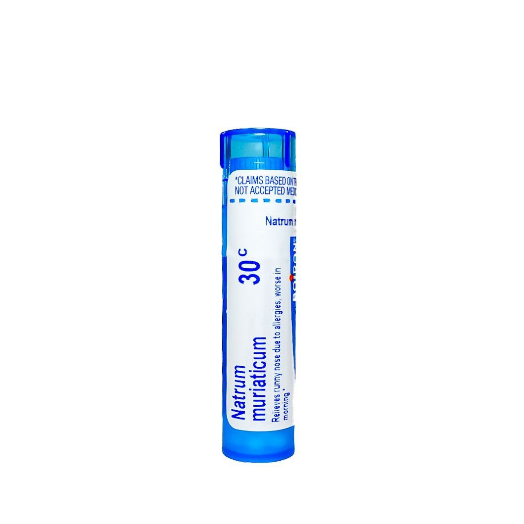 Blue medicine vial with a white label and blue cap, labeled “Natrum Muriaticum 30C.”