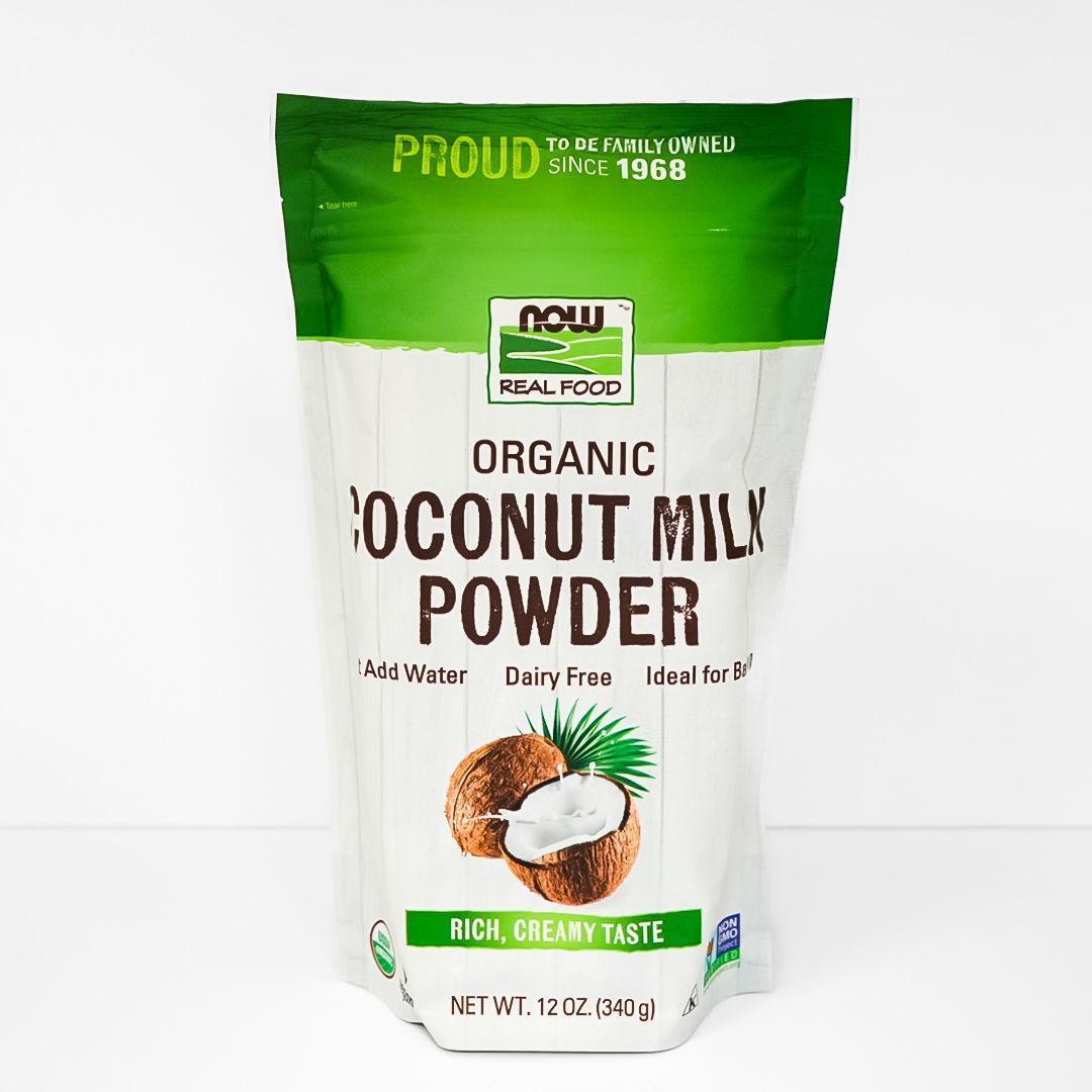 Green-and-white pouch of NOW Organic Coconut Powder with coconut image and bold product label