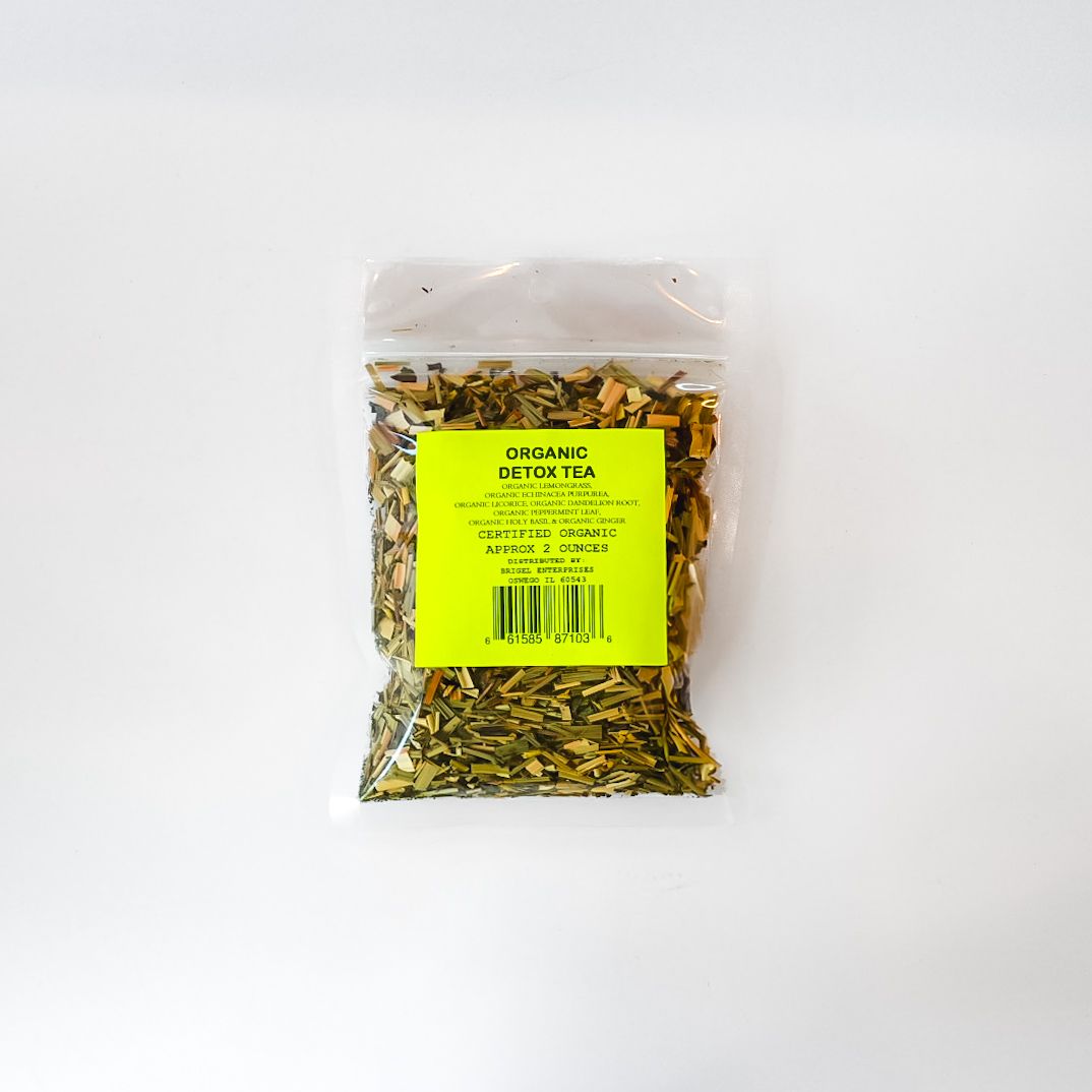 Clear plastic bag of dried herbs or tea with a bright yellow label on a white background