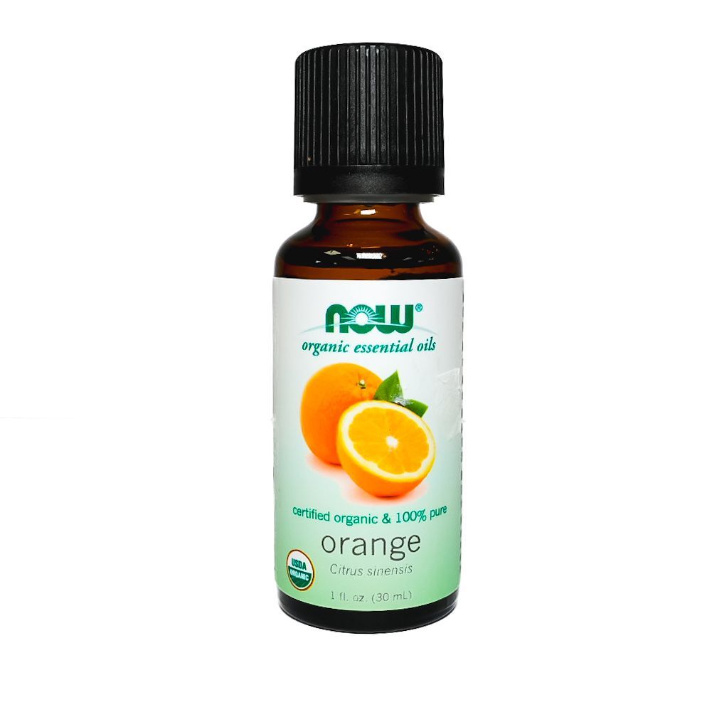Bottle of NOW orange essential oil with orange slice label on white background