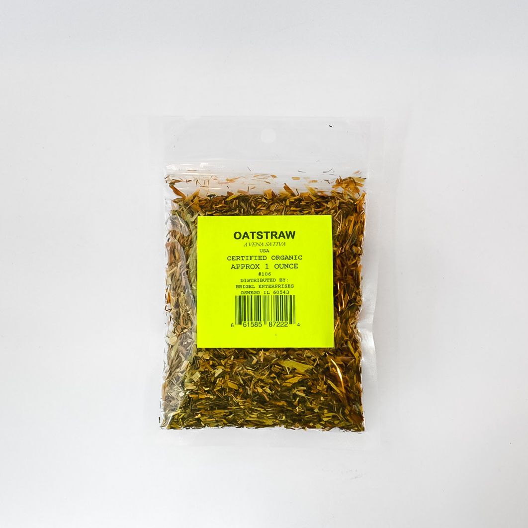 Clear plastic bag of dried herbs with a bright yellow label on a white background