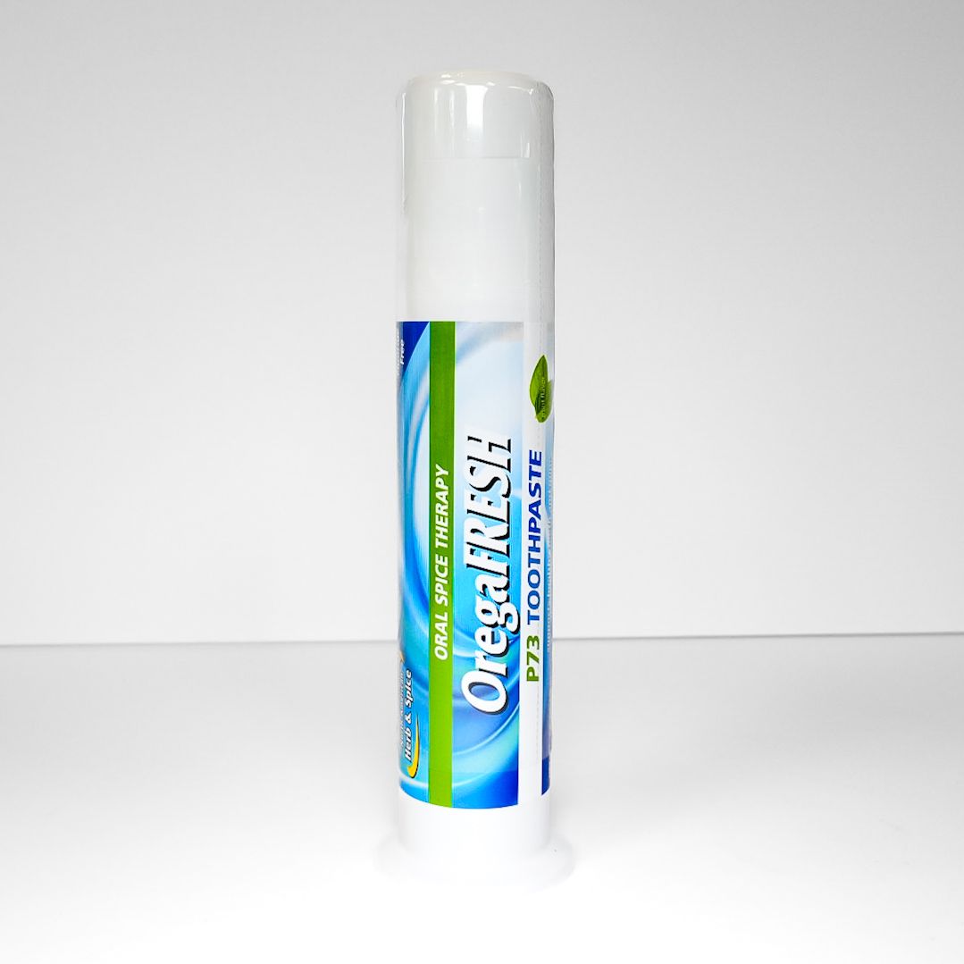 White-capped blue-and-green Oral-B toothpaste tube standing upright on a white surface.