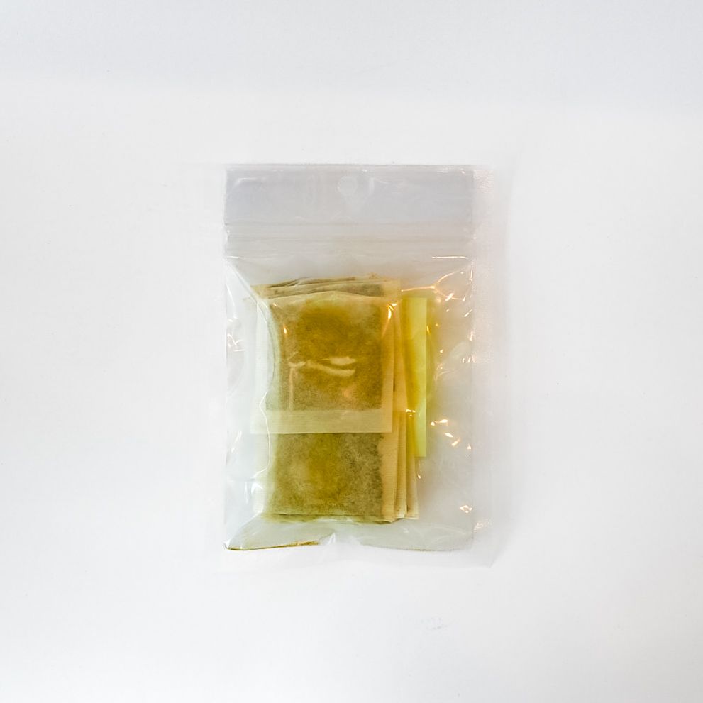 Small clear plastic bag with a bright yellow label and barcode on a white background