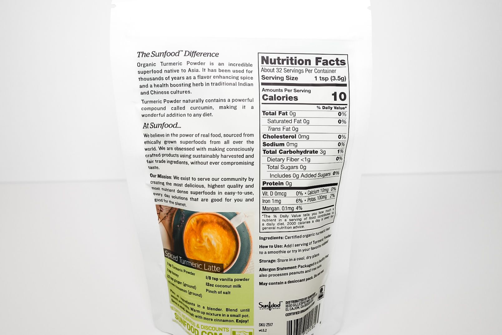 Sunfood Organic Turmeric Powder pouch with turmeric roots and yellow powder on white background
