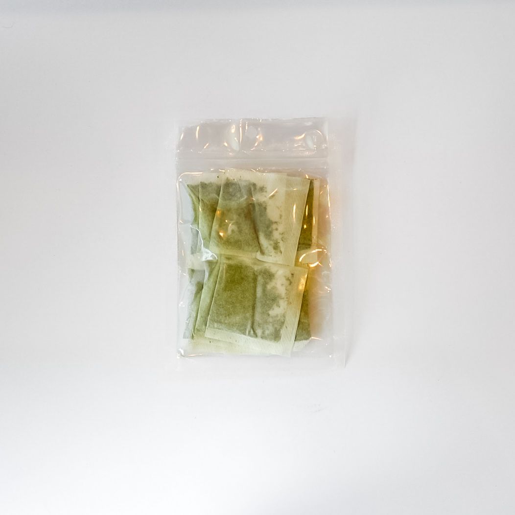 Small packaged item in clear plastic with a bright yellow label on a white background