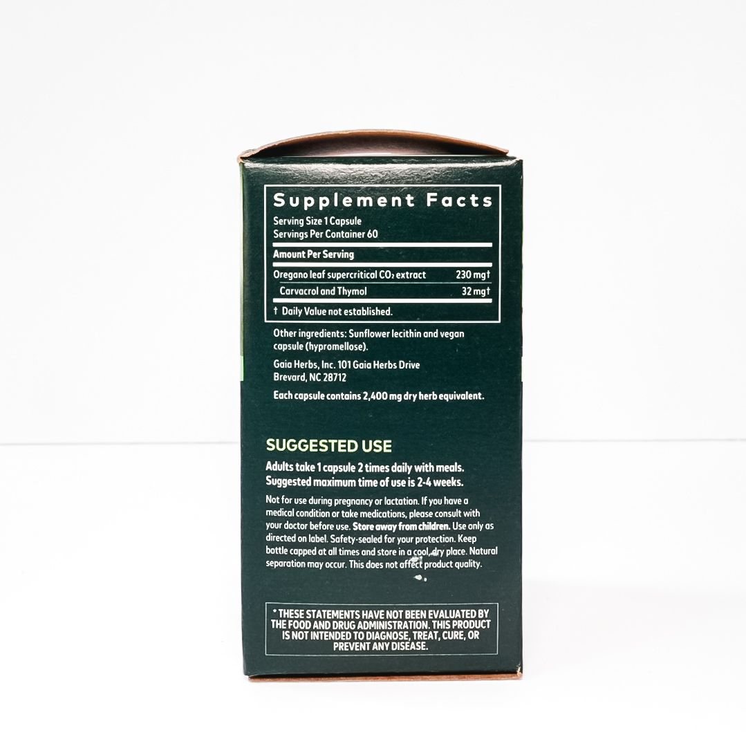Gaia Herbs Oil of Oregano supplement box with green leaves and white flowers on a white background