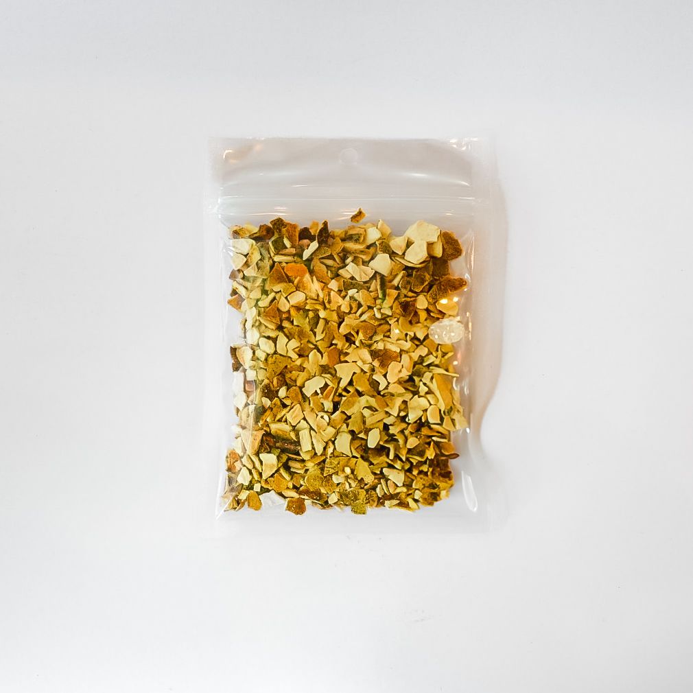 Clear bag of dried orange peel with a bright yellow label on a white background