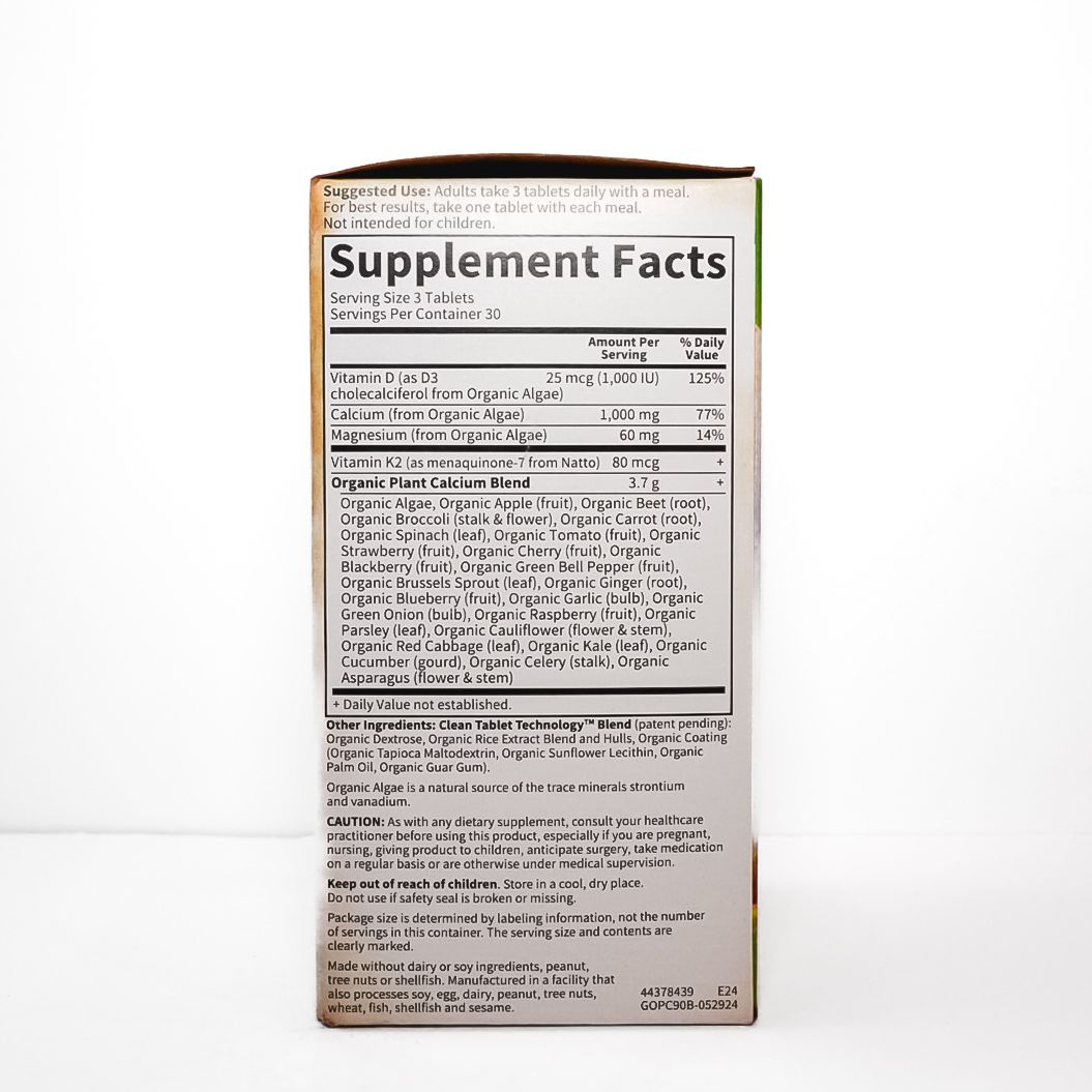 Orange Organics Organic Plant Calcium supplement box with fruit and leafy graphics on a white background