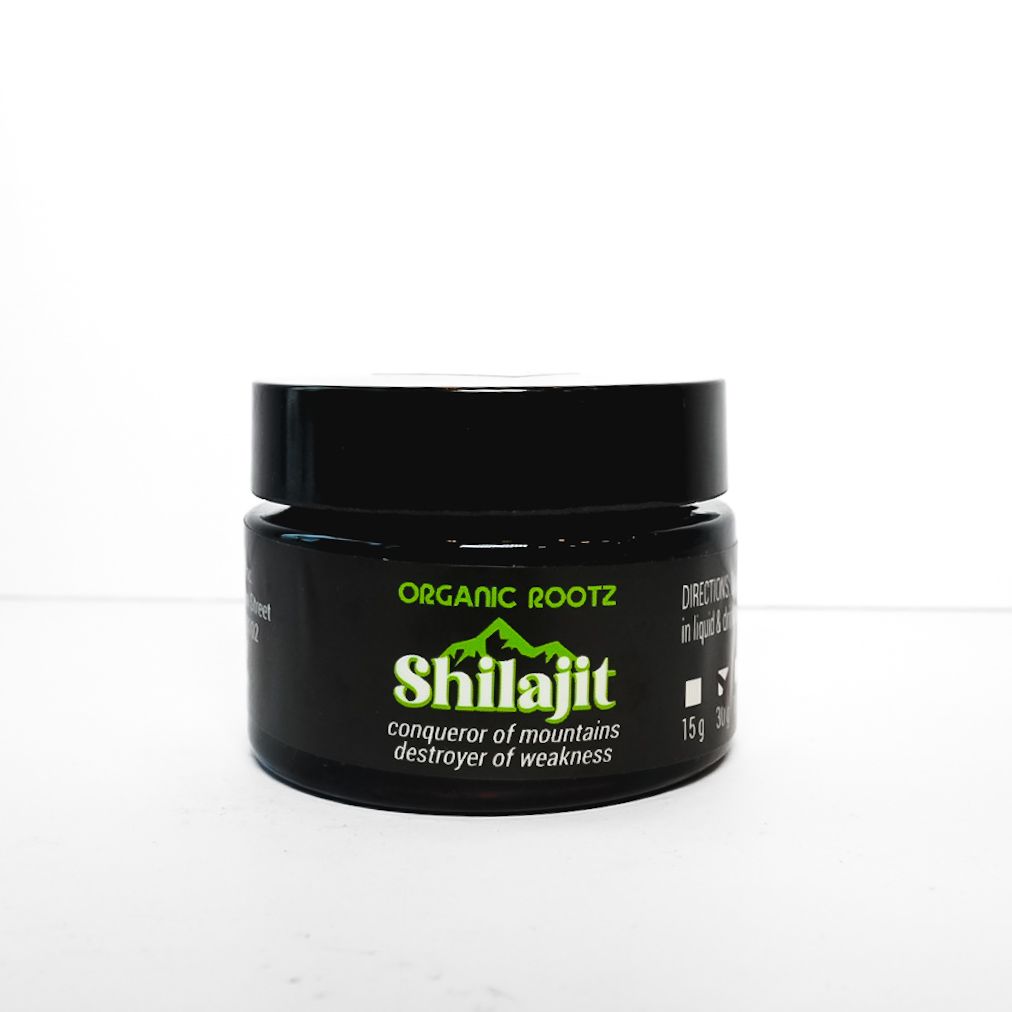 Black Organic Rootz Shilajit supplement jar with green and white label on a white background