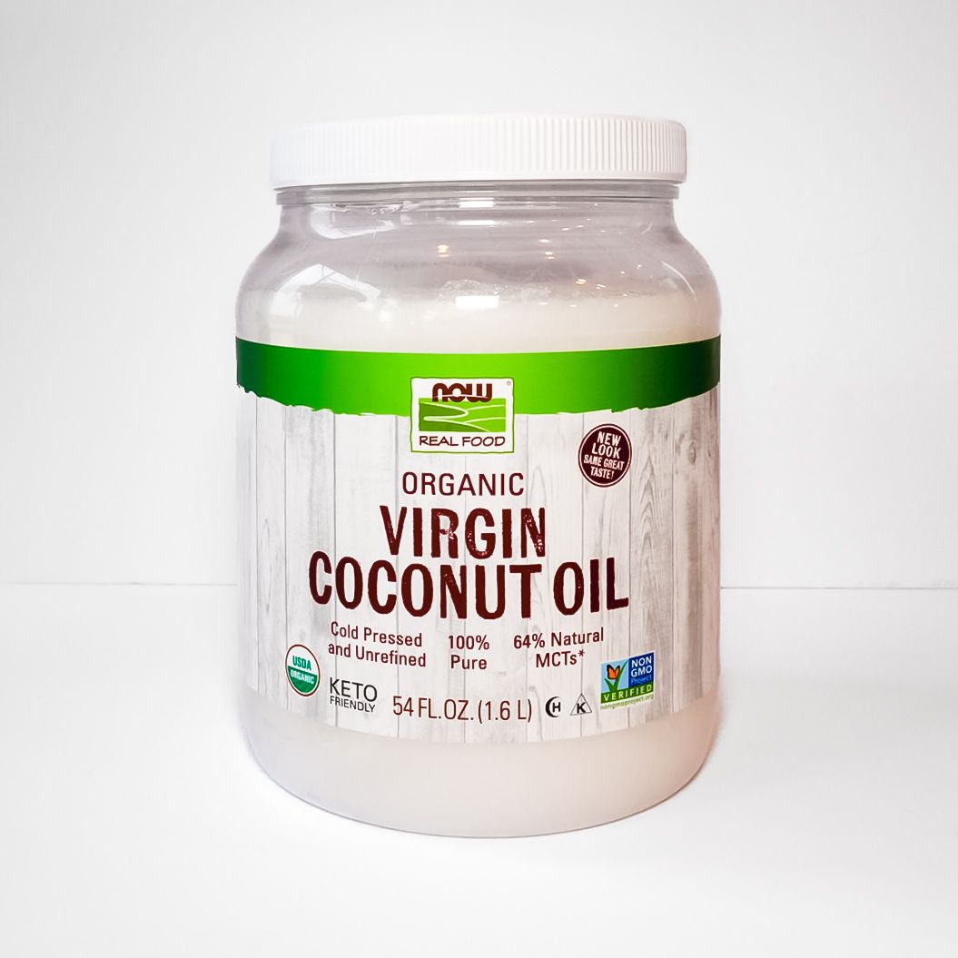 Jar of NOW Foods organic virgin coconut oil with green label on white background