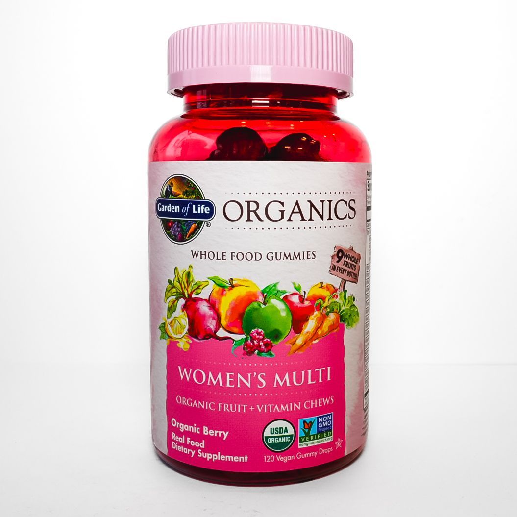 Bottle of Organics Women’s Multi vitamins with a pink label and white cap