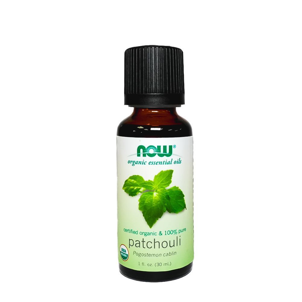 Small bottle of NOW Essential Oils patchouli essential oil with a black cap and green leaf label
