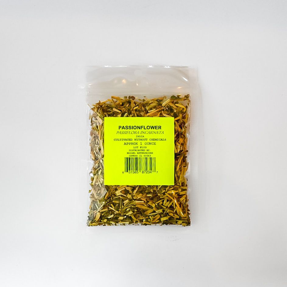 Clear plastic bag of dried herbs with a bright yellow label on a white background