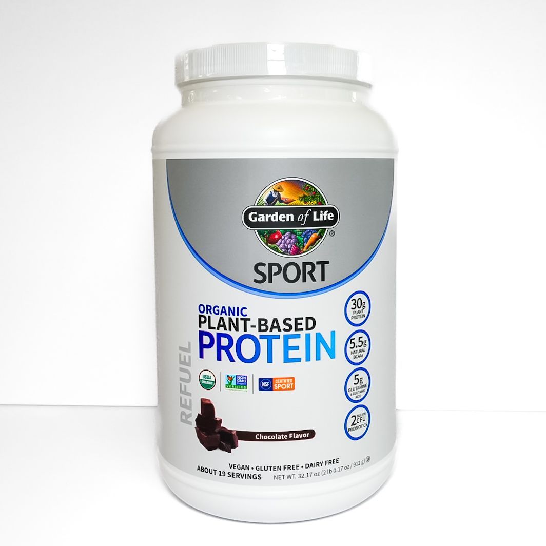 White tub of Garden of Life SPORT Organic Plant-Based Protein powder on a white background
