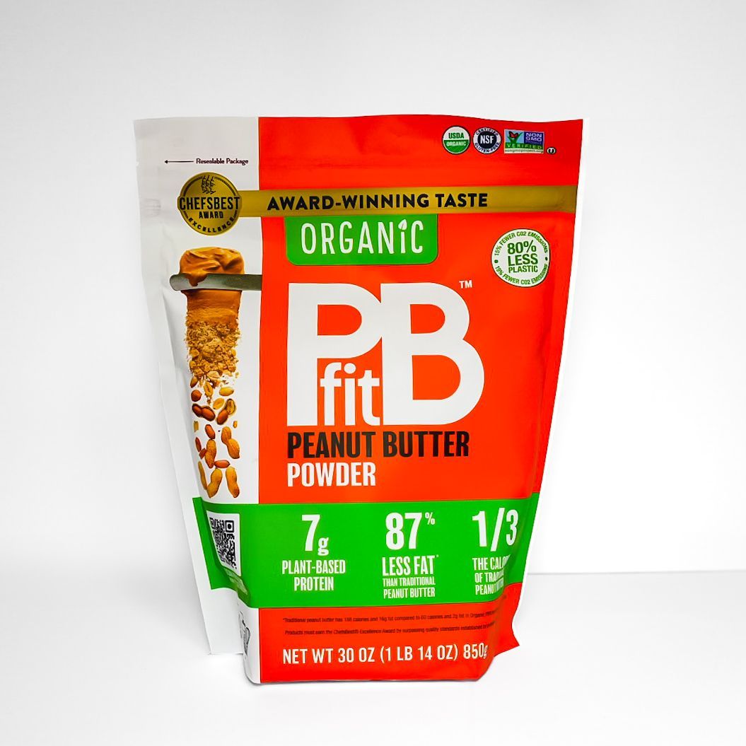 Orange bag of FitB organic peanut butter powder on a white background