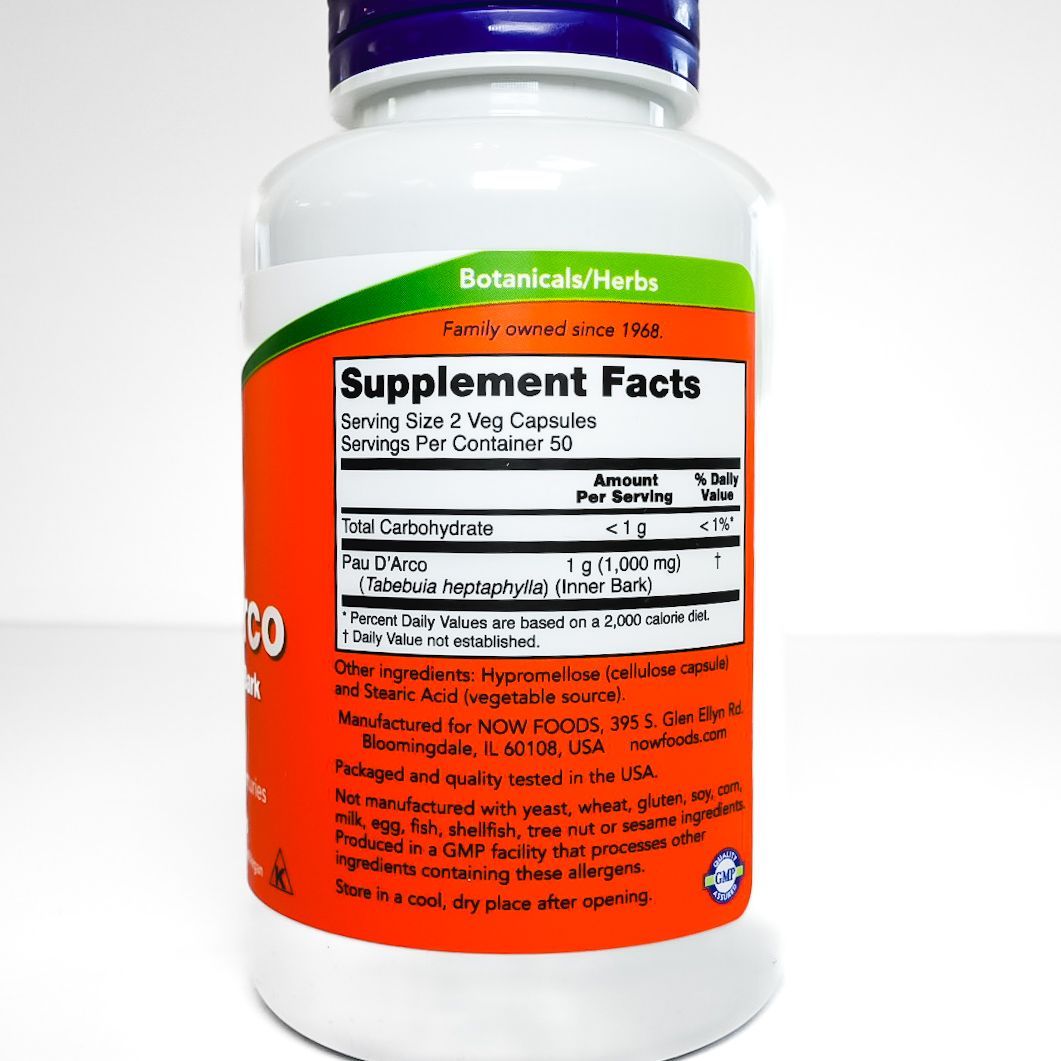 White NOW brand supplement bottle with orange label reading “Pau D’Arco” and blue cap