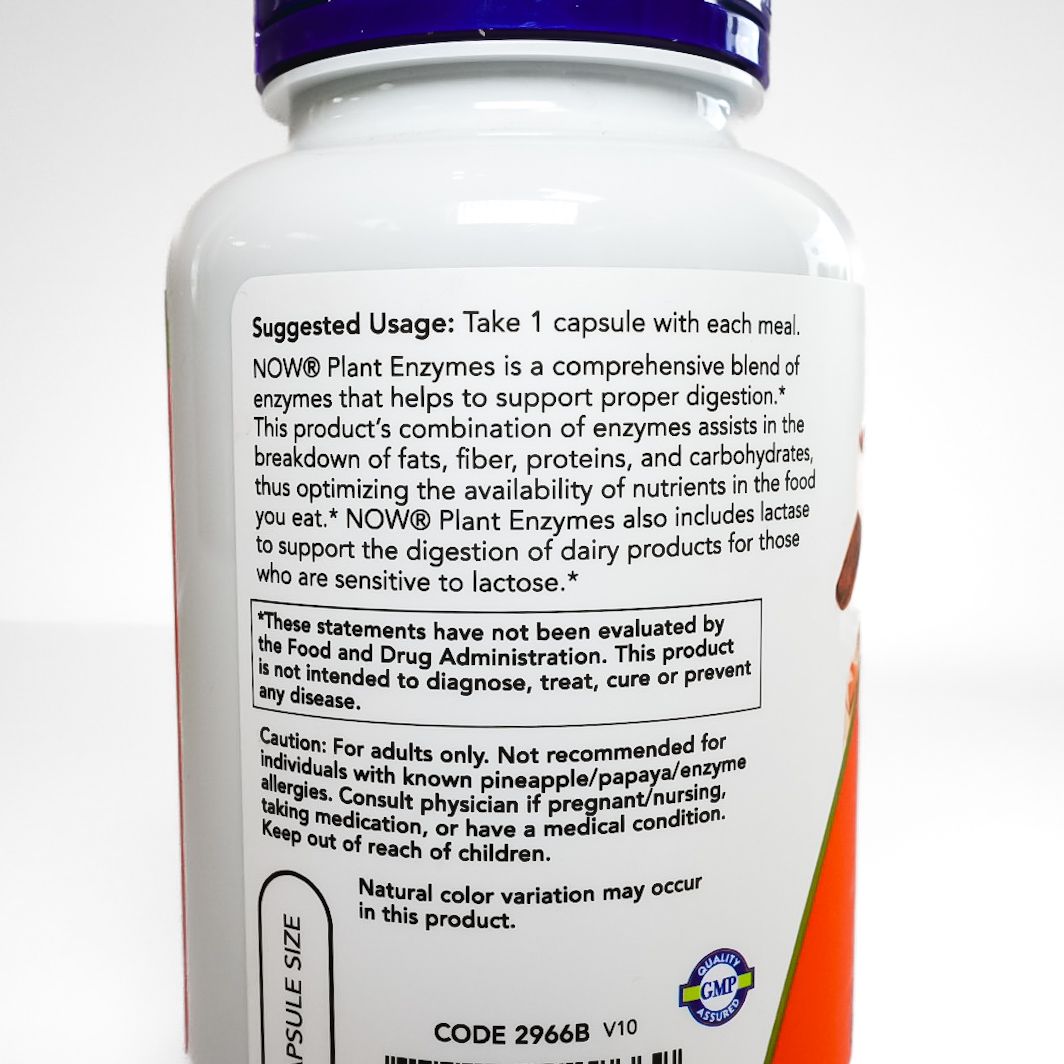 White NOW Foods Plant Enzymes supplement bottle with orange label and purple cap