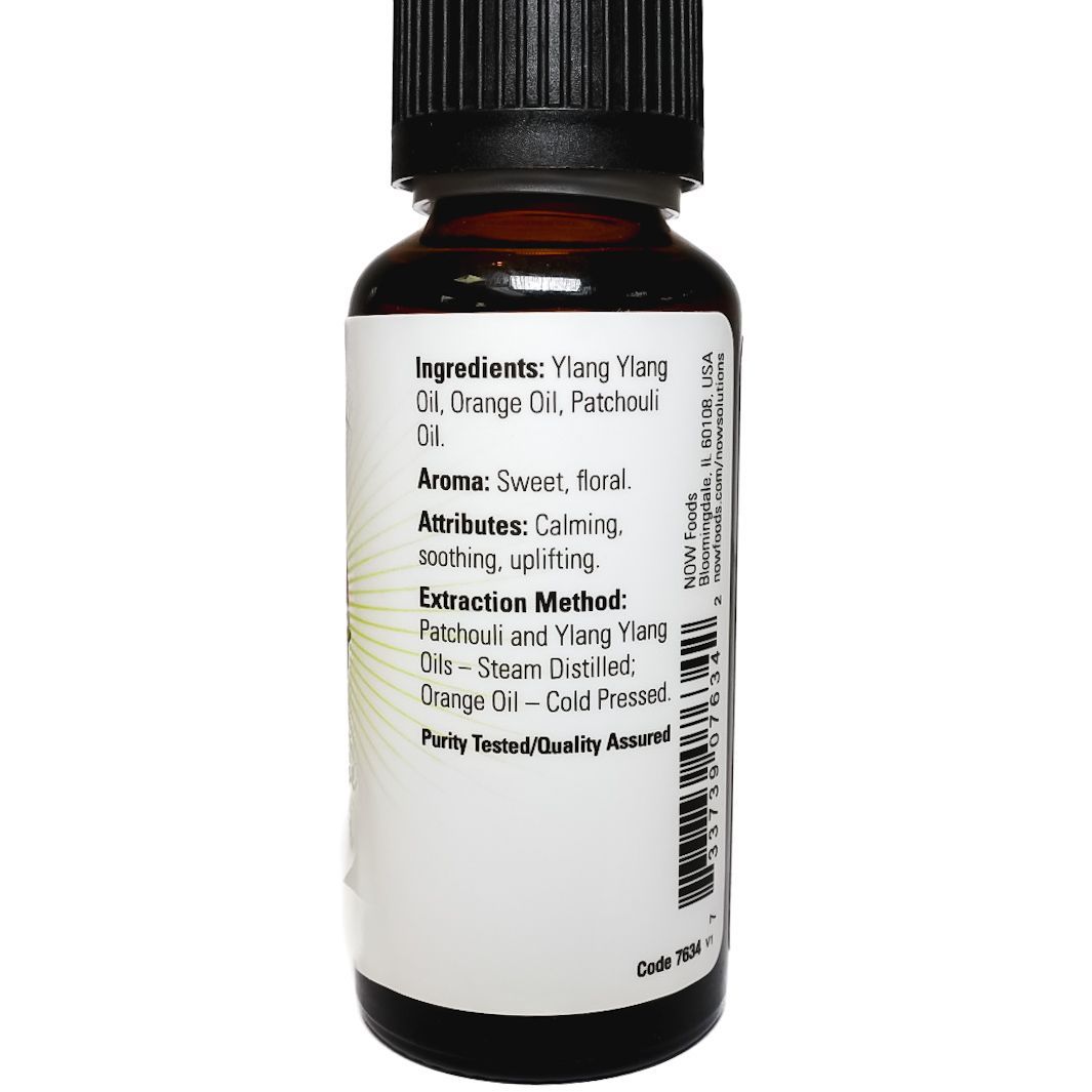 NOW Peace, Love & Flowers aromatherapy essential oil bottle with purple label and black cap