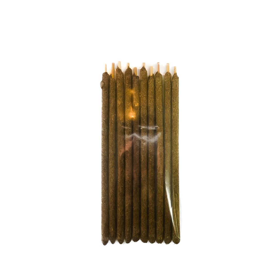 Pack of brown incense sticks with a bright yellow label and barcode on a white background