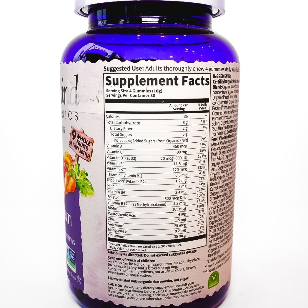 Purple bottle of Mykind Organics prenatal multivitamin with fruit and vegetable graphics on the label