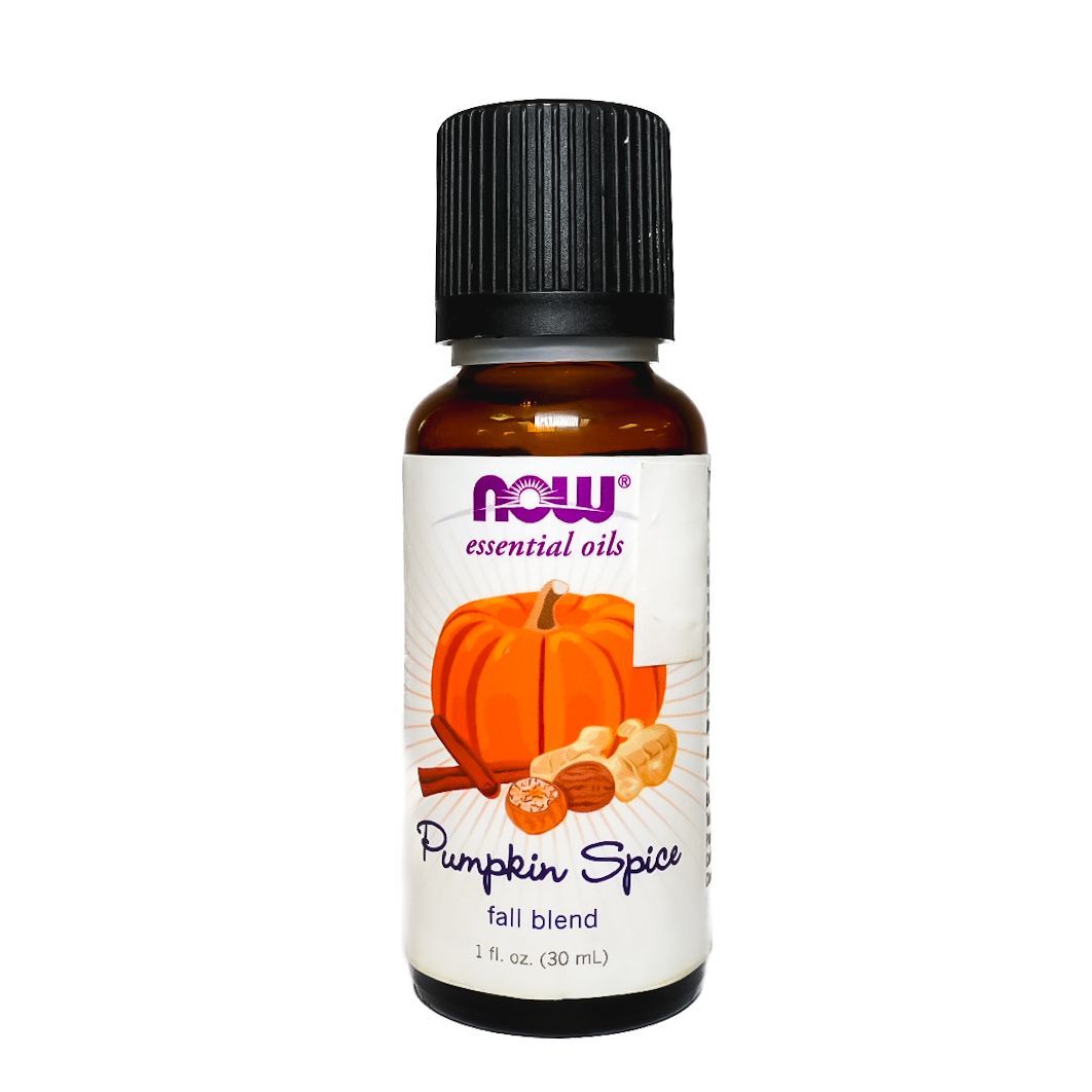 NOW Pumpkin Spice essential oil bottle with black cap and orange pumpkin label