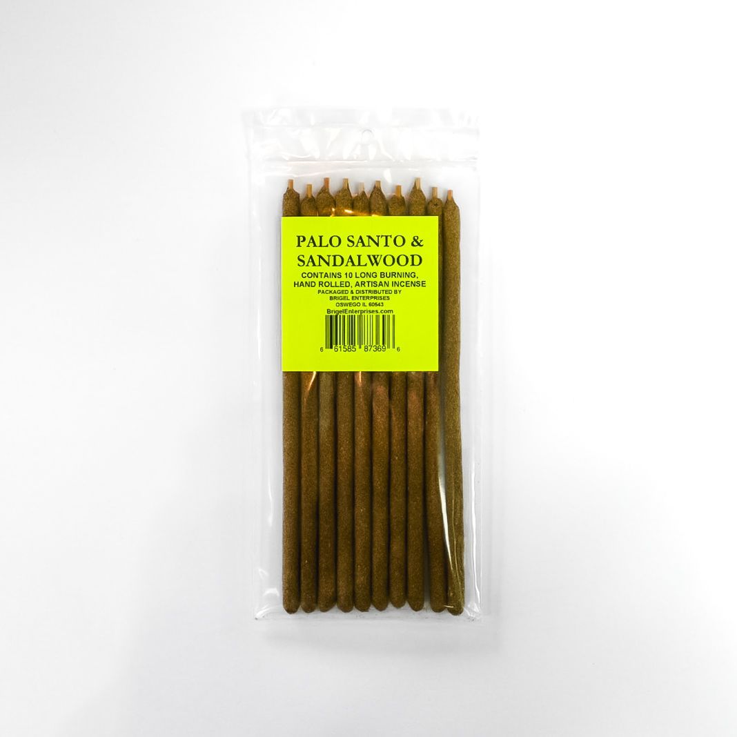 A clear plastic package of brown Palo Santo sticks with a bright yellow label.