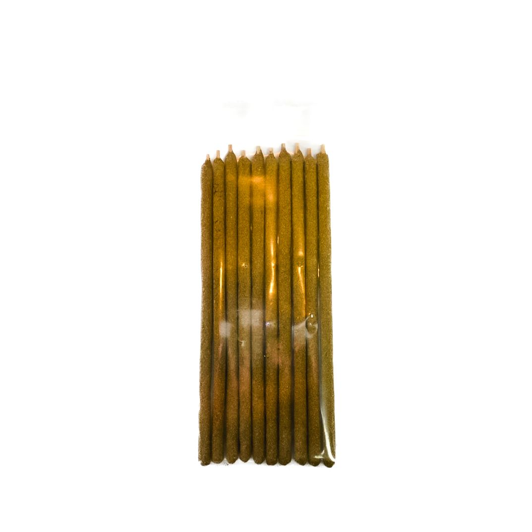 A clear plastic package of brown Palo Santo sticks with a bright yellow label.