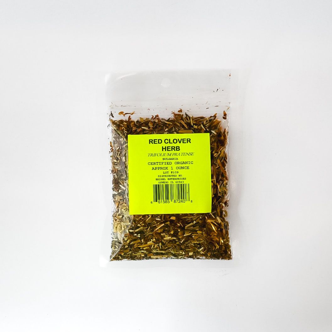 Clear plastic bag of dried herbs with a bright yellow label on a white background