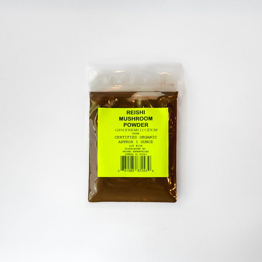 Clear plastic bag of mushroom powder with a bright yellow label on a white background