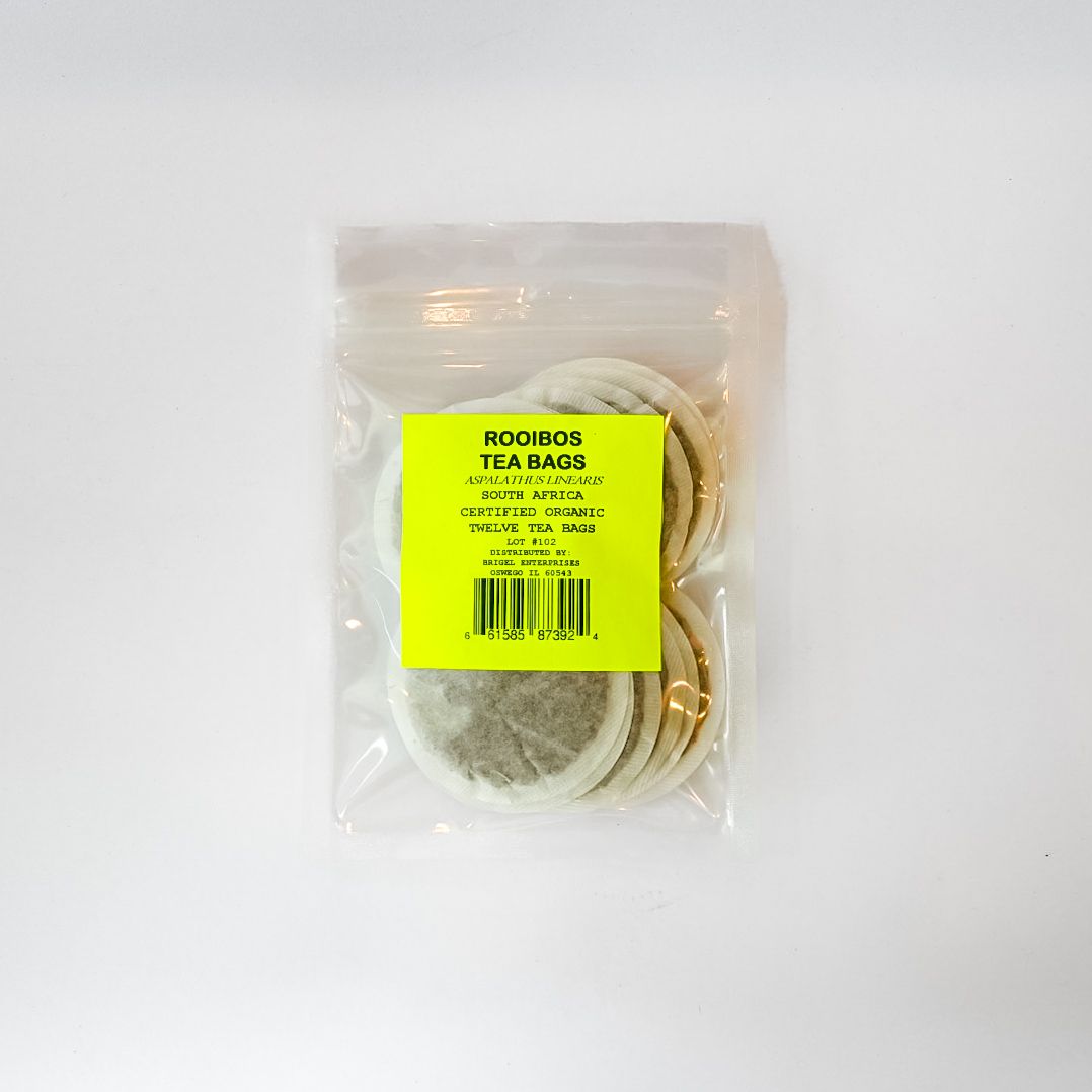 Clear bag of assorted tea bags with a bright yellow label on a white background