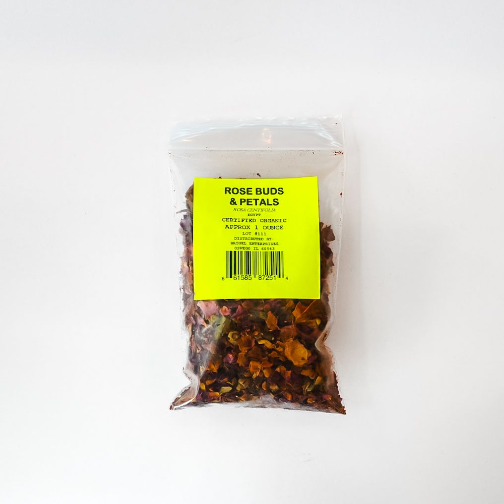 Clear bag of dried rose buds with a bright green label on a white background