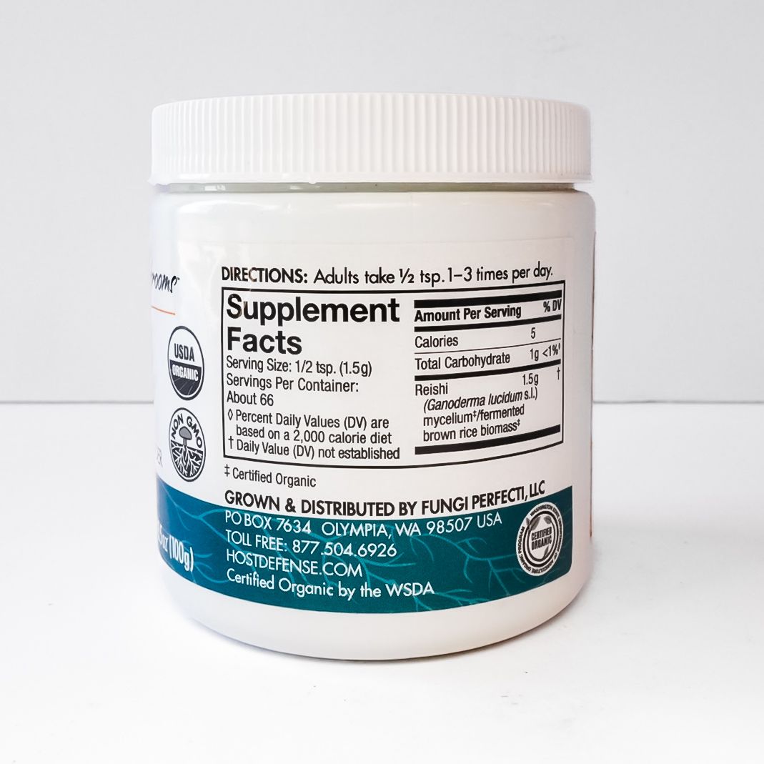 White jar of Host Defense Reishi mushroom dietary supplement with teal and beige label.