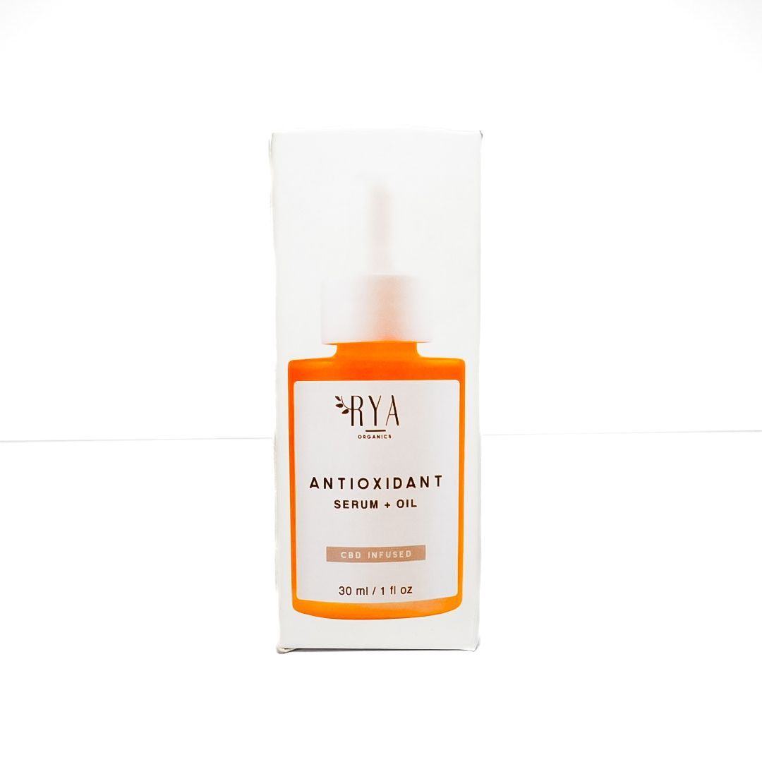 Orange anti-oxidant serum bottle with white dropper cap on a white background