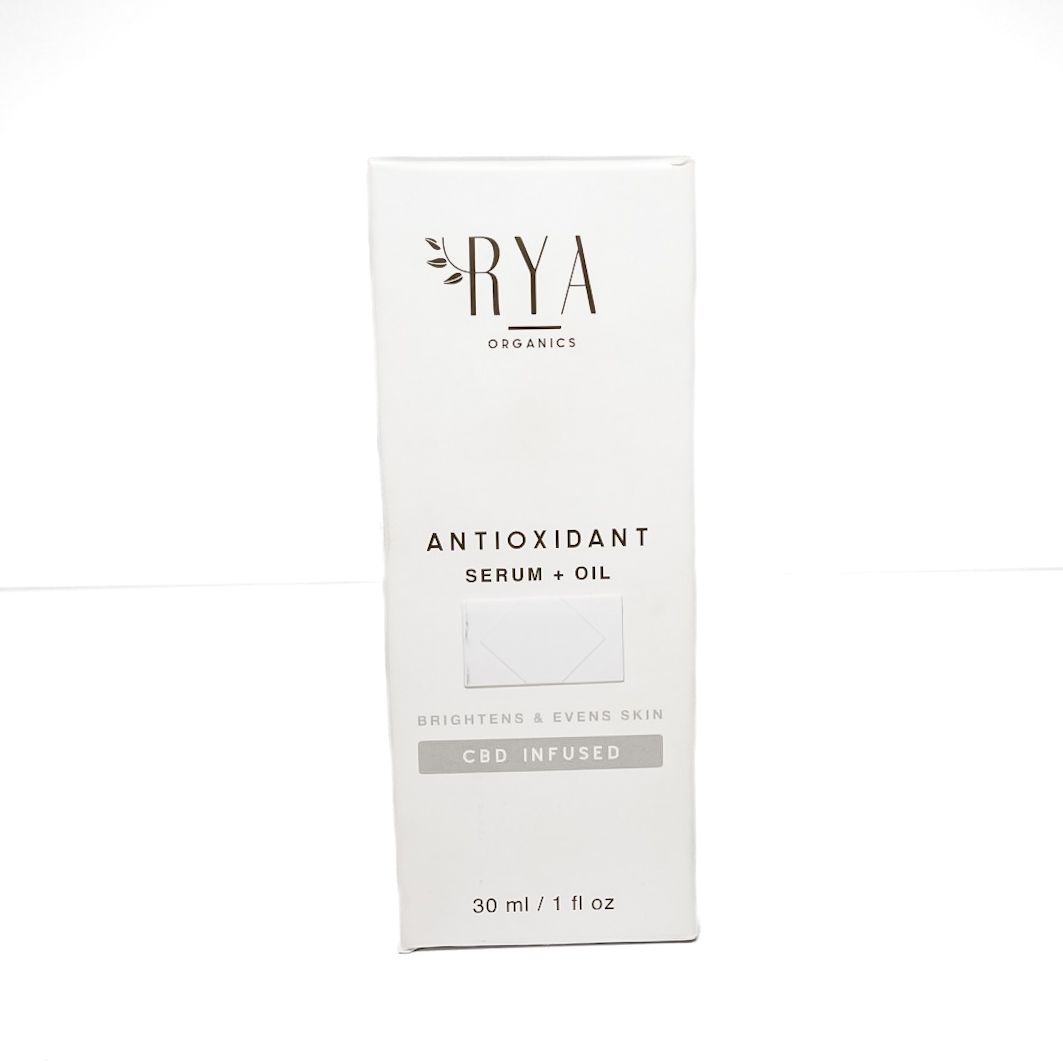 Orange anti-oxidant serum bottle with white dropper cap on a white background