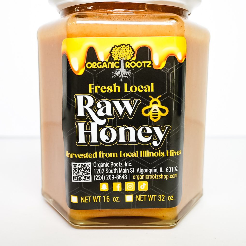Jar of Irish local raw honey with a white lid and black label on a white background