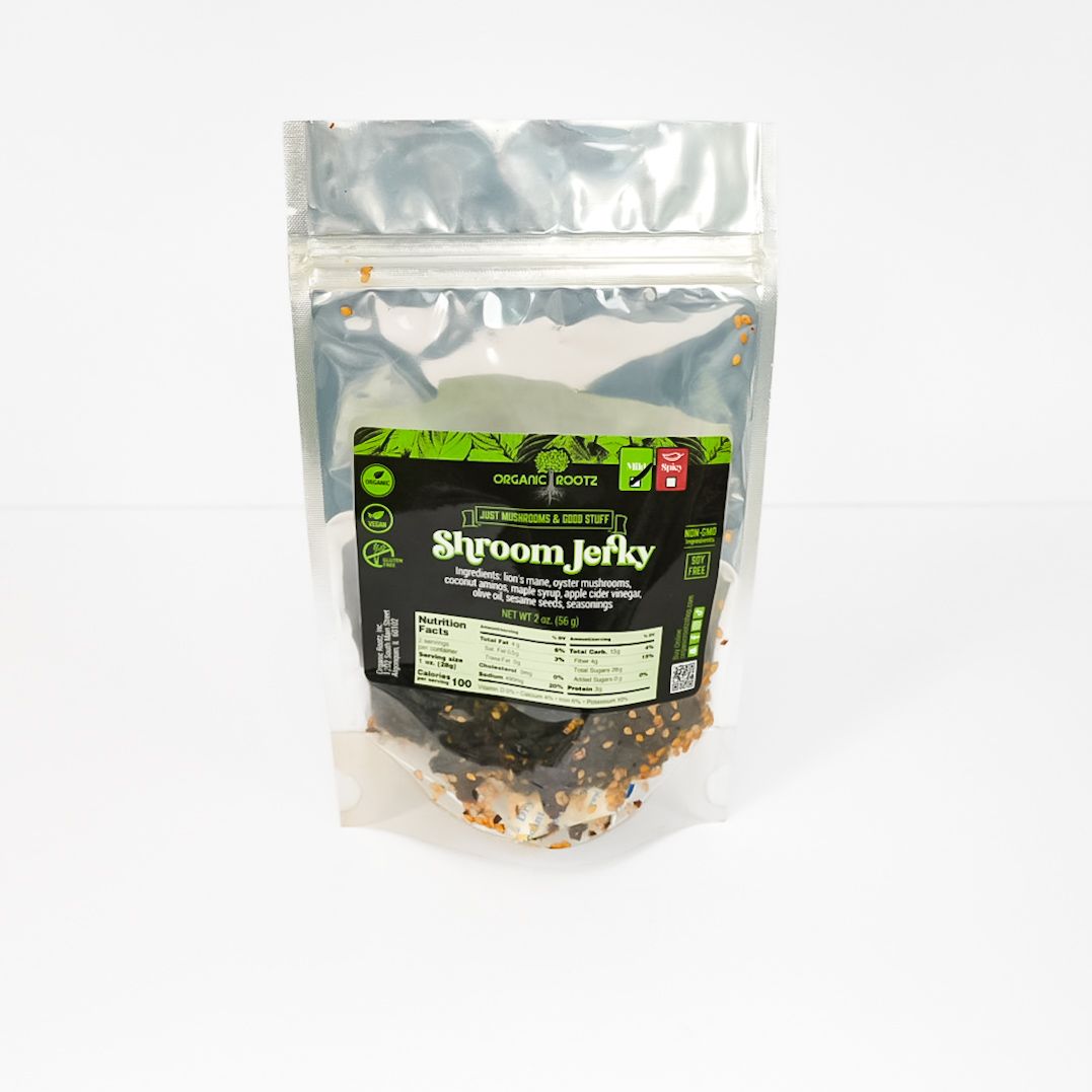 Silver resealable pouch of dried snack mix with black-and-green label on white background