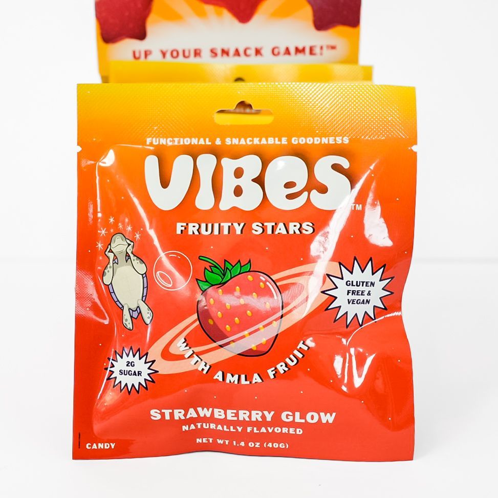 Orange bag of Vibes Fruity Stars strawberry glow gummies with strawberry graphics and bold white text